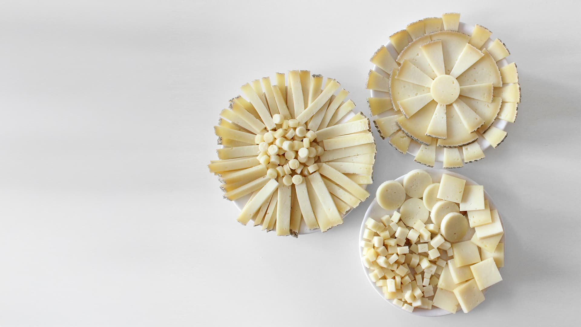 Manchego cheese in different cuts