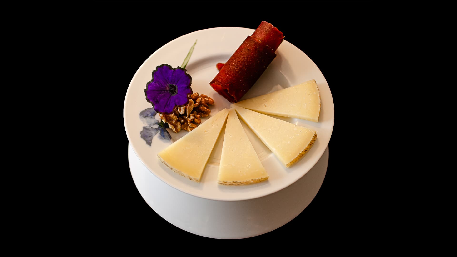 Manchego cheese with quince paste and walnuts