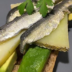 Las Terceras hard-cured Manchego cheese P.D.O. with avocado, marinated sardines and bread