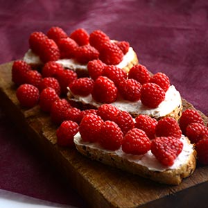 Cream cheese toast with raspberries
