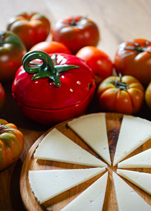 Manchego cheese with seasonal tomatoes