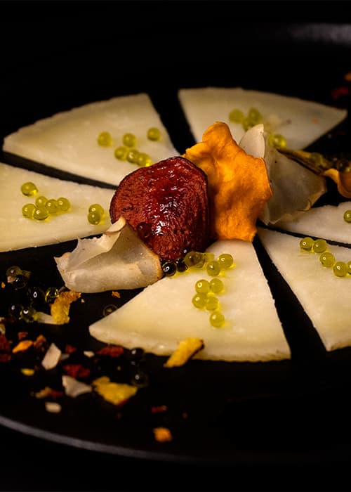 Manchego cheese with vegetable contrasts