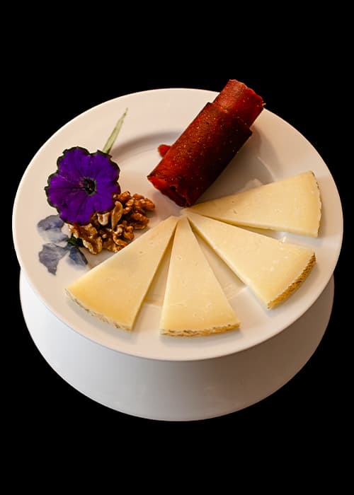 Manchego cheese with quince paste and walnuts
